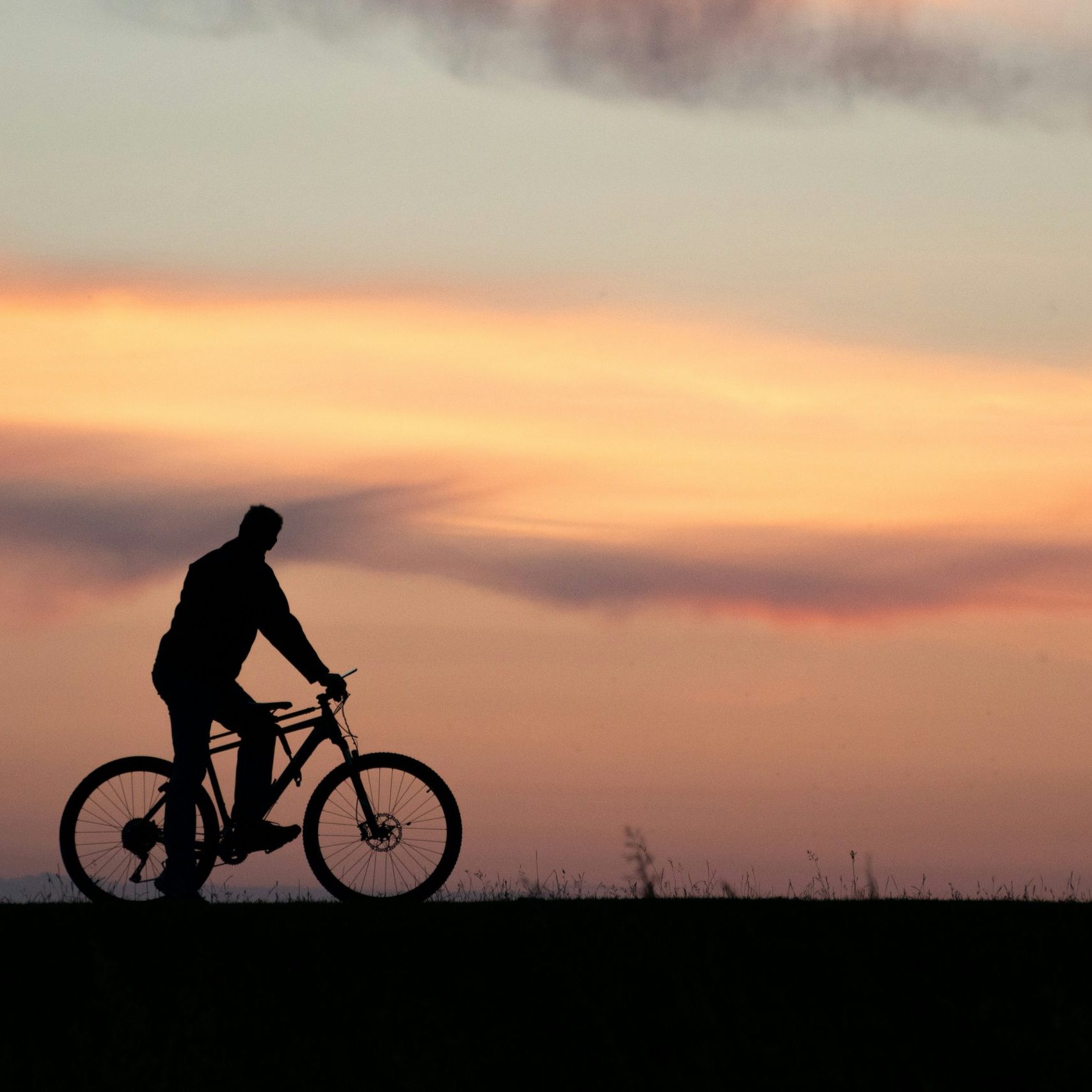 Cycling in the sunset - bring a cycling solar panel for longer rides