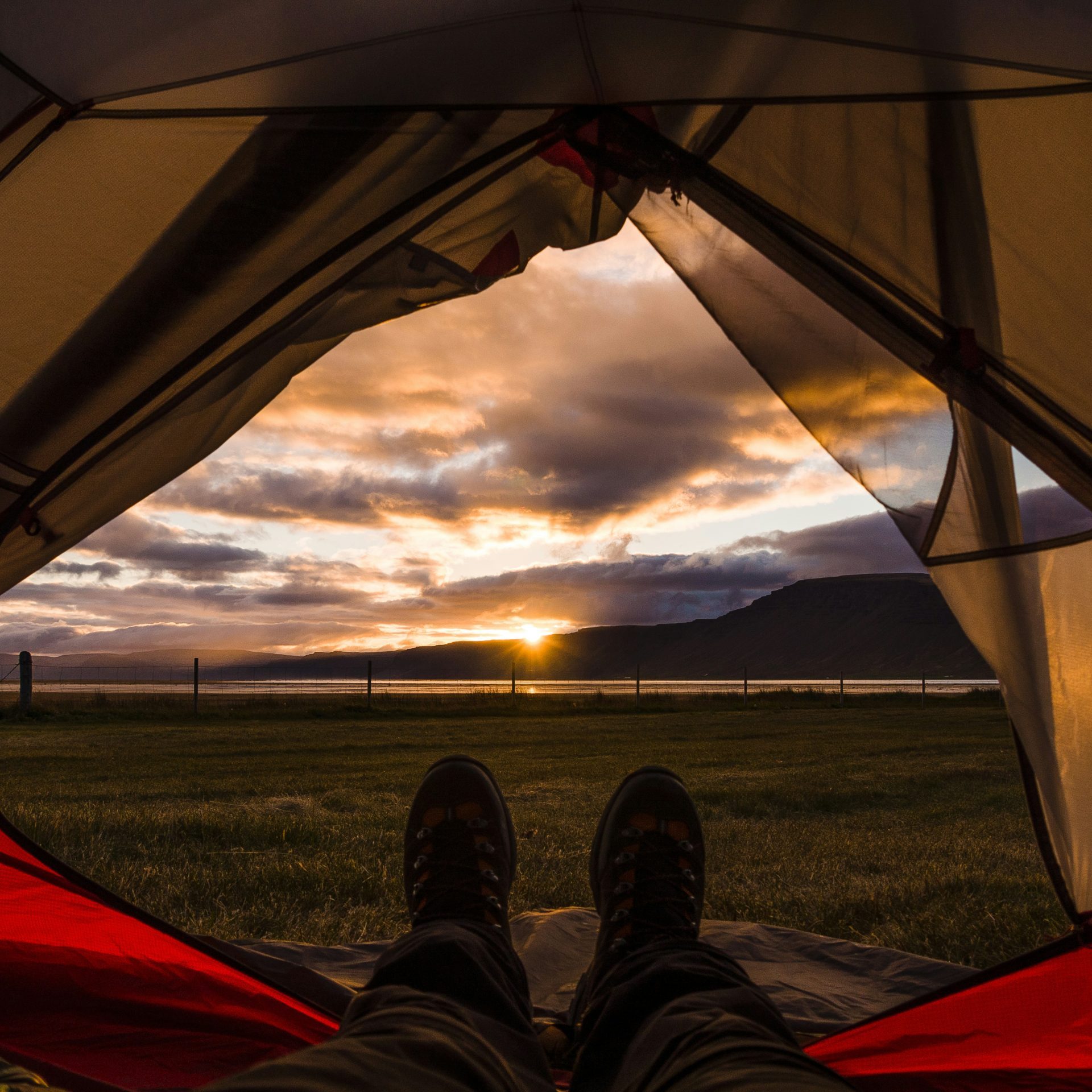 Sunset in tent A sunset seen from the inside of a tent - powered with solar power for tent