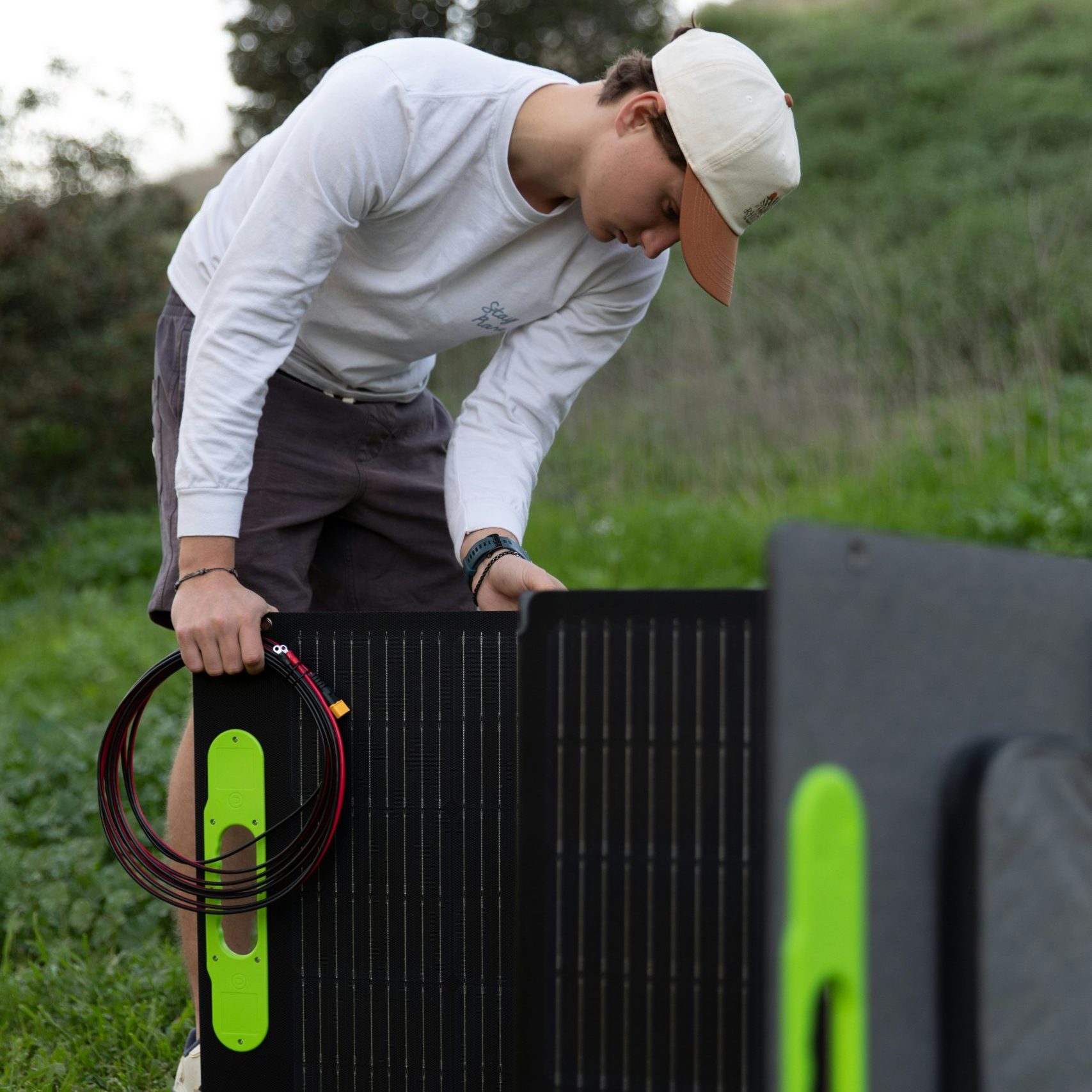 portable solar panels vertical A man with a portable solar panel for tents and more
